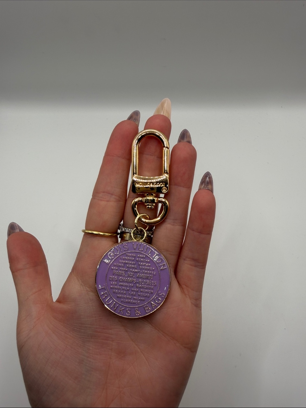 1491. Gold Tone Keychain with Purple Round Medallion